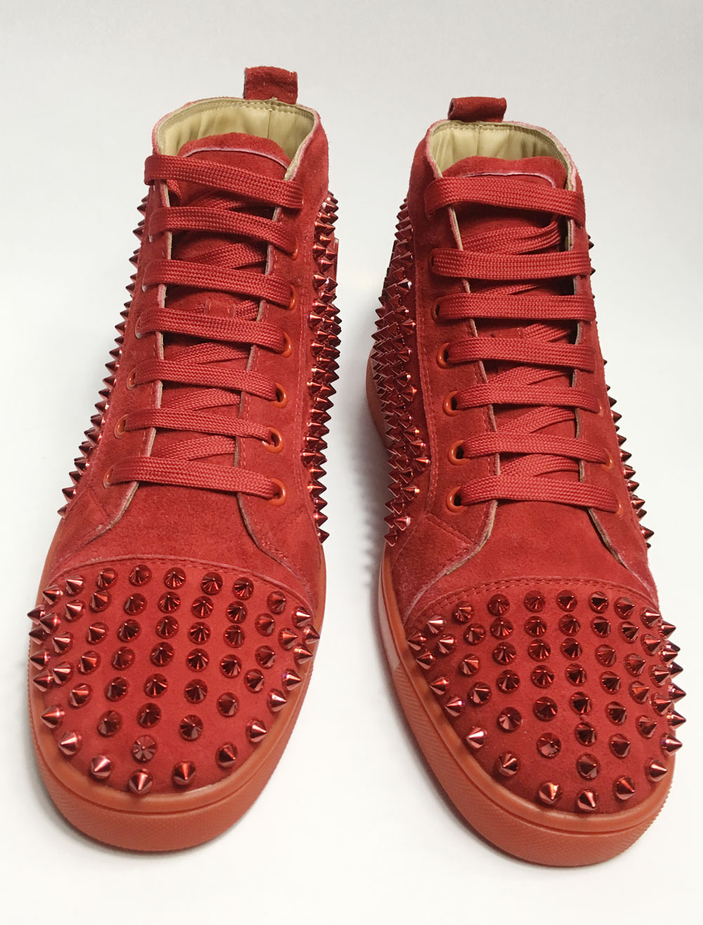 red spike shoes