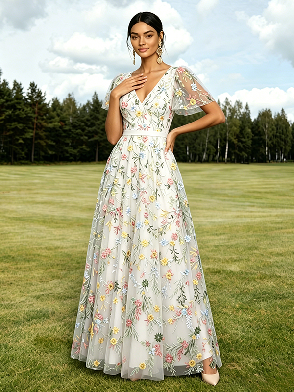 Robe longue de soirée lilas poudré en tulle brodé de fleurs col V manches courtes papillon coupe trapèze robe d'invitée de mariage