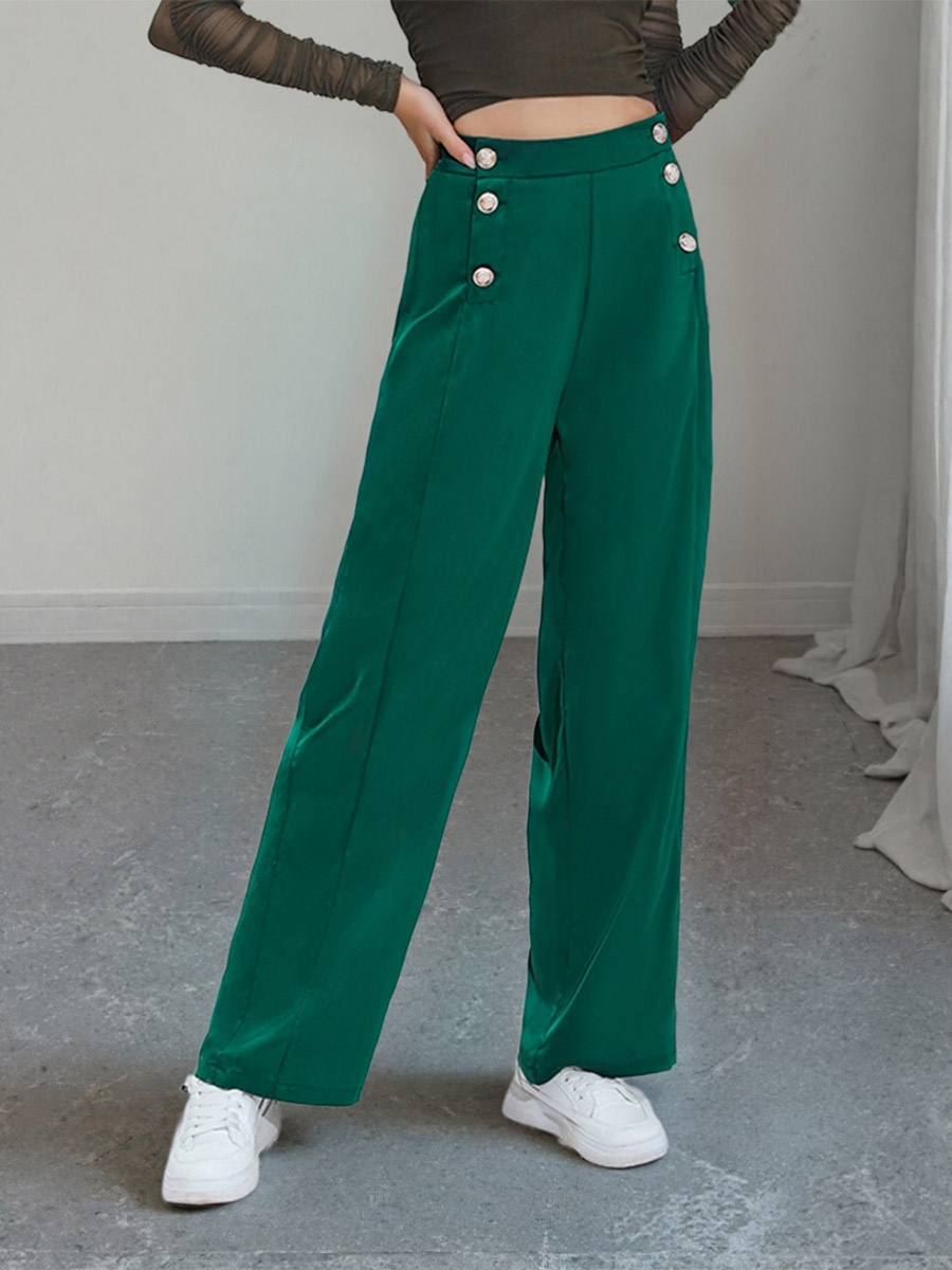 Pantalon de costume taille haute à double boutonnage et jambes larges coupe drapée.