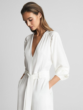 アイボリーブライダルジャンプスーツサッシュ床の長さ A ライン V ネック長袖ウェディングジャンプスーツ無料カスタマイズ