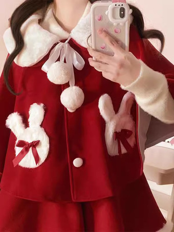 Atuendos dulces de Lolita: capa falda sin mangas y lazos rojos