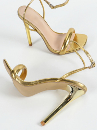 Sandalias doradas de tacón alto con punta abierta y tiras en el tobillo para fiesta