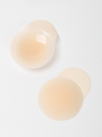 Cubrepezones adhesivos invisibles de PVC con forma de triángulo y cobertura total.