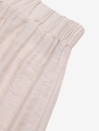 Short beige à taille élastique pour femme avec bordure ondulée noire style décontracté taille haute coupe ample idéal pour l'été.