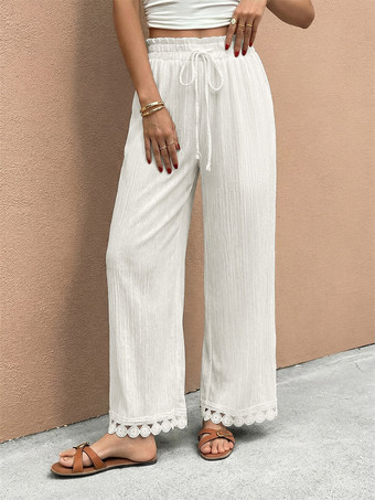 blanc Pantalon large à ourlet en dentelle blanche et cordon de serrage coupe ample et décontractée idéal pour l'été.