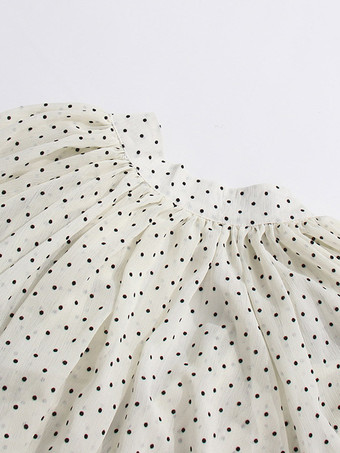 Blouse blanche pour femme col en V manches longues lacées et à volants.