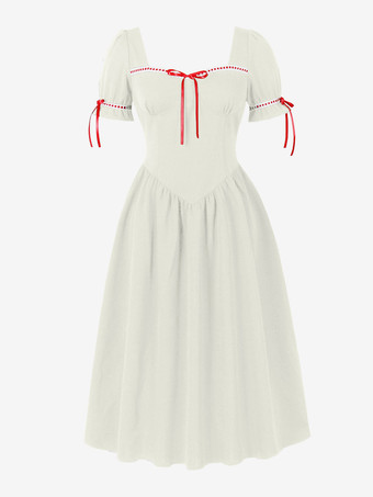 Robe vintage pour femme manches bouffantes coupe midi col carré nœud sur le devant évasée.