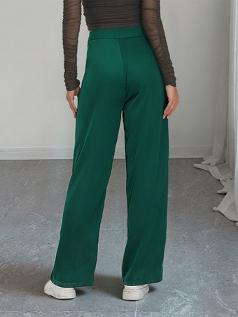 Pantalon de costume taille haute à double boutonnage et jambes larges coupe drapée.