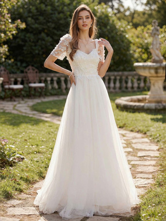 Robe longue blanche trapèze à fleurs et dos nu pour mariée 2026